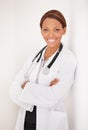 My dream job. Portrait of a smiling ethnic woman doctor with her arms folded. Royalty Free Stock Photo