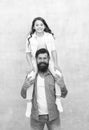 My father is super. Father carry daughter piggyback. Little child and father have fun together. Happy family. Fathers Royalty Free Stock Photo