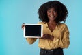 My favourite app could be yours too. Studio shot of a young woman holding a digital tablet with a blank screen against a