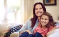 My favourite movie with my favourite girl. a beautiful mother and her adorable daughter bonding at home.