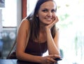 This is my favourite place to hang out. Portrait of an attractive young leaning against a counter top.