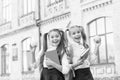 My funny friend. back to school. two small girls ready to study. do homework together. sisters at break with apple Royalty Free Stock Photo