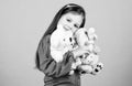 My funny friend. happy childhood. Birthday. little girl playing game in playroom. small girl with soft bear toy. child Royalty Free Stock Photo