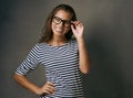 My glasses and I are happy together. Studio shot of an attractive young woman wearing glasses. Royalty Free Stock Photo