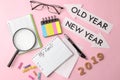 My goals 2019. text in a notebook with colored stickers and a pen, glasses, magnifier on a bright pink background