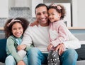 My greatest treasure will always be my family. Portrait of a father bonding with his two little daughters at home. Royalty Free Stock Photo