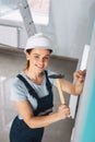 Delighted builder hammering a nail