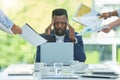 My head is about to explode. a young businessman looking overwhelmed while suffering from a headache in his office. Royalty Free Stock Photo