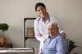 Portrait of smiling doc and retired patient in doctor office Royalty Free Stock Photo