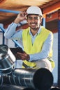 My job is to do the stock-take. a handsome young contractor crouching down and doing a stock-take in the warehouse.