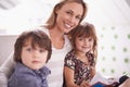 My little bookworms. a mother reading with her children at home. Royalty Free Stock Photo