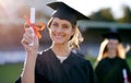 This is my main key to unlock many opportunities. Portrait of a university student standing amongst her classmates on Royalty Free Stock Photo