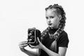 my new camera. cheerful girl with retro look isolated on white. kid vintage fashion. child take photo on retro camera Royalty Free Stock Photo