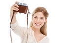 My new profile photo. A beautiful young photographer standing with her camera against a white background. Royalty Free Stock Photo