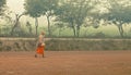 Uttar Pradesh, India - Jan 2017: Man is going through the empty field