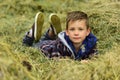 My own pleasure. Little boy relax on wheat field. Little boy on farm field. Cultivating and growing wheat. Enjoying Royalty Free Stock Photo