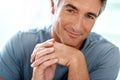 My personal style is relaxed. Headshot portrait of a handsome mature man smiling while looking at the camera during the Royalty Free Stock Photo