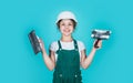 This is my place. kid wear helmet on construction site. teen girl plasterer with tool spatula. child on repairing work Royalty Free Stock Photo