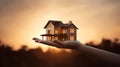 My precious home on the hands of a happy family and real estate investment and housing architecture and sunset background,