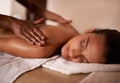 My relaxing place...a young woman enjoying a relaxing massage at a day spa. Royalty Free Stock Photo