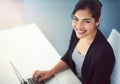 My sights are set on higher things. High angle portrait of an attractive young businesswoman working on a laptop in her Royalty Free Stock Photo