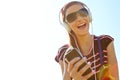 This is my song. A happy young teeanage girl listening to music over her headphones. Royalty Free Stock Photo