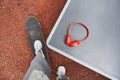 Man standing with one leg at the skate and preparing to taking his headphones Royalty Free Stock Photo