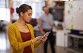 My tablet helps me innovate easily. a businesswoman using a digital tablet at work. Royalty Free Stock Photo