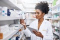 My tablet helps me with safe and accurate stock management. a pharmacist using a digital tablet in a chemist. Royalty Free Stock Photo