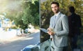 My tablet keeps me connected anywhere. Portrait of a handsome young businessman using a digital tablet outside.