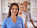 My team has my back. Three confident young businesswomen smiling at the camera.