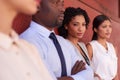 My team and I are unstoppable. Portrait of a young businesswoman standing amongst her colleagues outdoors. Royalty Free Stock Photo