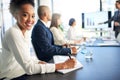 My team knows how to produce the most dynamic work. Portrait of a young businesswoman sitting in a boardroom meeting Royalty Free Stock Photo