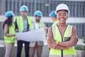 My teams got it covered. Cropped portrait of an attractive female construction worker standing with her arms folded and