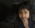 Portrait of Little girl in Inle market smiling and posing to camera, Myanmar