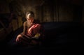 Myanmar - December 5, 2016:Little Novice Monk are reading the book in the cubicle of temple with window light, Mandalay