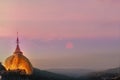 Take photo the Kyaikhtiyo Golden Rock pagoda and temple and beautiful sunshine view. This Photo contain burry and soft focus.,