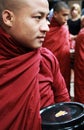Myanmar monk carrying his bowl