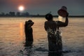 Myanmar - morning bath inside Irrawaddy river