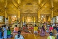 Myanmar people worship and pray in temple of golden Buddha at Mahar Shwe Thein Daw pagoda