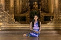 Myanmar woman in Burmese traditional dress at Shwenandaw Kyang monastery in Mandalay Myanmar