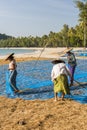 Myanmar women drying fish in the sun