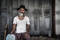 MYAWADDY, MYANMAR - FEBUARY 22, 2015 : Portrait of an old man wi