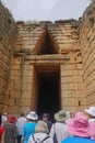 Mycenae, Greece: Tourists visit the Treasury of Atreus, or Tomb of Agamemnon Royalty Free Stock Photo
