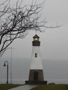 Myers Park lighthouse shines in winter lake fog