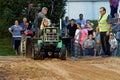 A Woman Drives at a Lawn Tractor Pull
