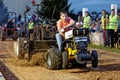 A Young Boy Drives at a Lawn Tractor Pull