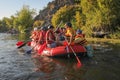 Group of adventurer enjoying rafting river