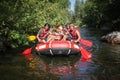 Group of adventurer enjoying rafting river