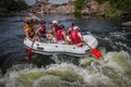 Group of adventurer enjoying rafting river